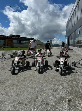 The Tapped team on mountain carts, wearing helmets